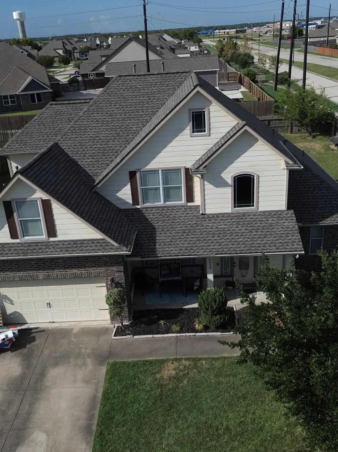 Gray shingle roof on a two-story home in Baytown, Texas.